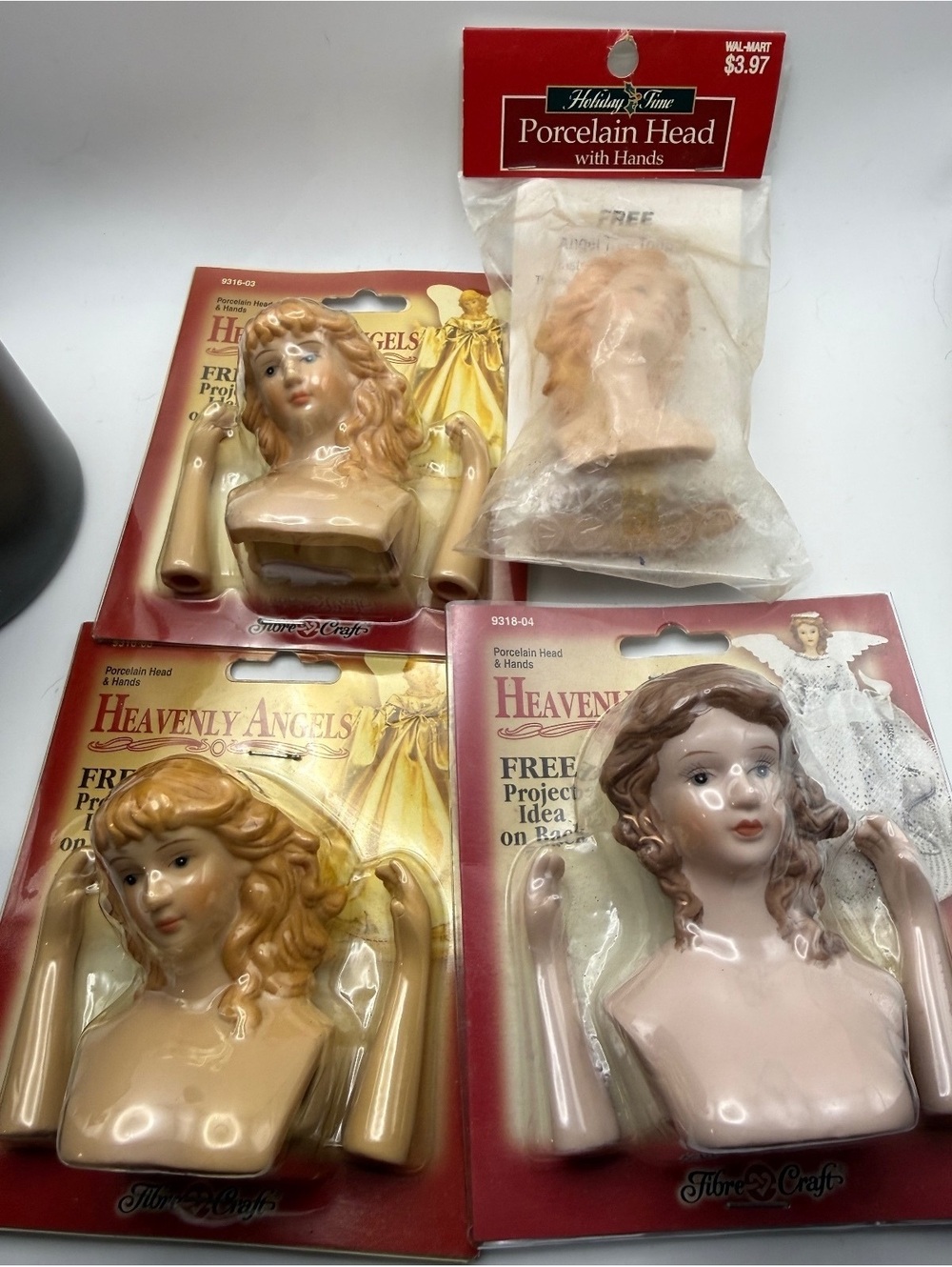 New/old porcelain angel heads/hand sets